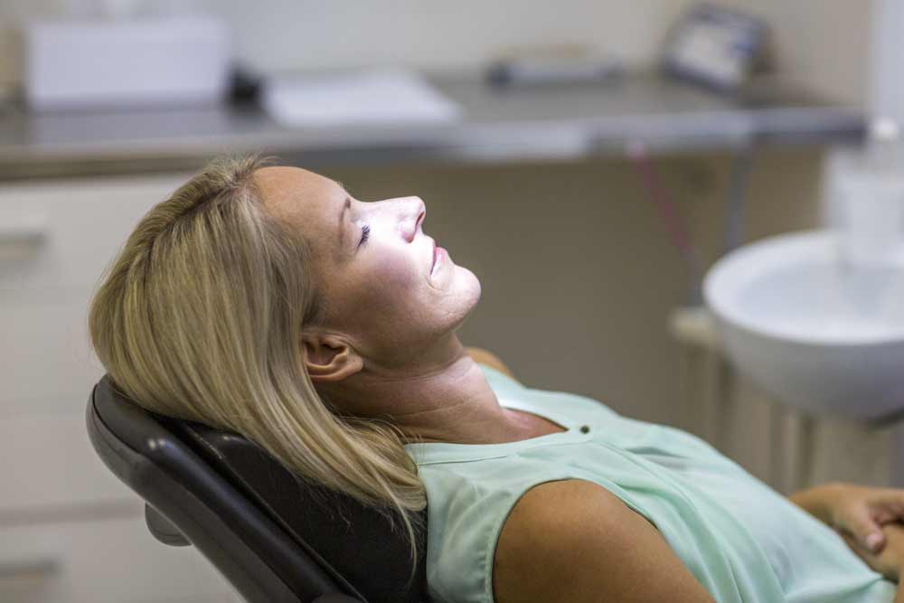 Woman relaxing in a dental chair